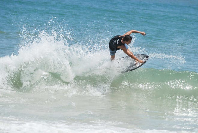 Tyler Ferris competes in the 18-to-21 amateur division of the 22nd annual Florida Skimboarding Pro/Am Tournament on Saturday at Vilano Beach.