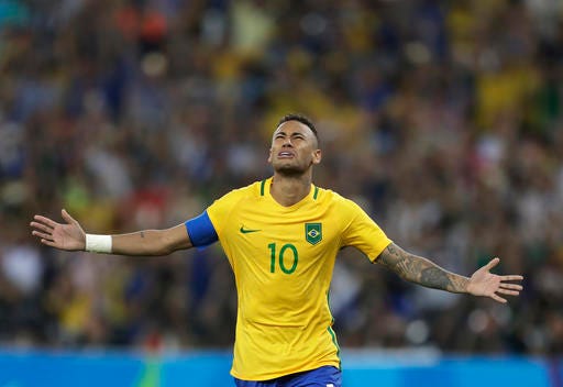 Brazil's Neymar celebrates after scoring the decisive penalty kick during the final match of the men's Olympic football tournament between Brazil and Germany at the Maracana stadium in Rio de Janeiro, Brazil, Saturday Aug. 20, 2016. Brazil won the gold medal on a penalty shootout. (AP Photo/Andre Penner)
