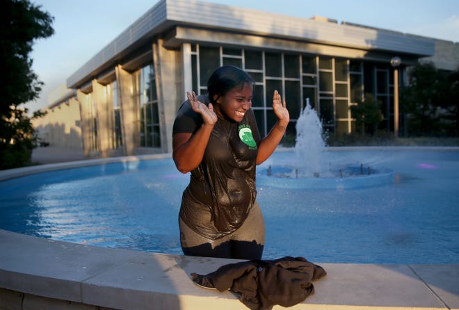 University of Missouri freshman Makayla Taylor laughs after wading briefly in the fountain Thursday near the MU Student Center. Wading in the fountain is a tradition for MU students. Classes start Monday with what is expected to be the smallest freshman class in 10 years