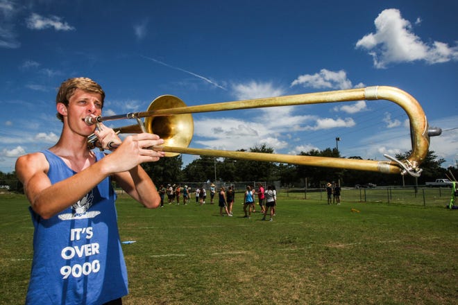 Justin Foelker of DeLand High School will be marching with his bass trombone in the Macy's Thanksgiving Day Parade as part of an all-star band of high school students from across the country. The opportunity has given his family something to rally around in the wake of his father's sudden death last Christmas. NEWS-JOURNAL / LOLA GOMEZ