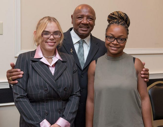 Marvin Hagler, center, honored Andrea Malin (left) and Brockton resident Schona Riley as this year's recipients of the Massasoit Community College Marvelous Marvin Hagler Scholarship Award
during a ceremony on Friday.