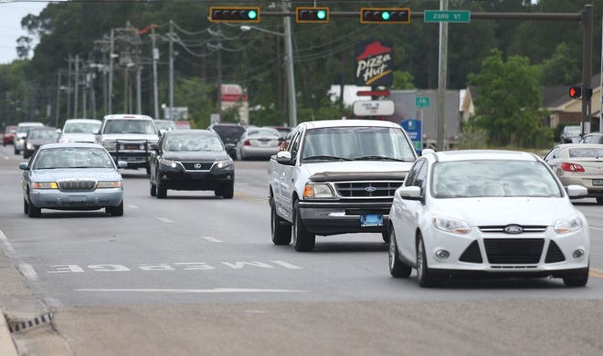 Vehicles are driven north along Jenks Avenue in Panama City. City officials will vote Tuesday on lowering the bill for widening Jenks between 23rd Street and Baldwin Road.