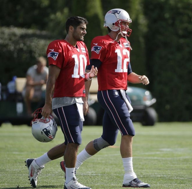 Tom Brady (12) will watch as Jimmy Garoppolo (10) starts the first four games of the season for New England.
