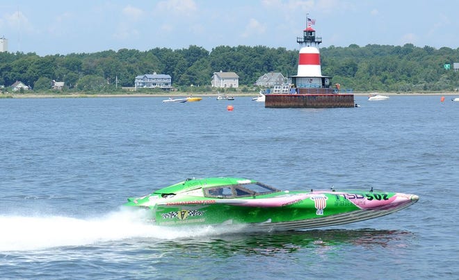 Her first time on the throttle of a racing boat, Audra Bezanson has Early Detection in full cry, with Chris Reindl, the boat's owner, piloting the vessel on the Taunton River racecourse past Borden Flats Lighthouse in 2015.