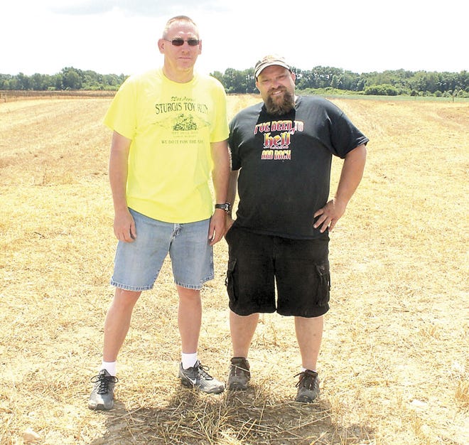 2016 Sturgis Toy Run president Pat Linnan and vice-president Gust Pollins pose at the Toy Run field located at 28731 Kelly Road. This year's event is scheduled for Sept. 8-10.