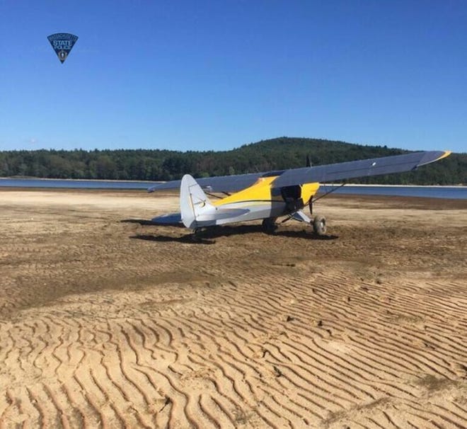 A photo provided by Massachusetts State Police shows the 2015 fixed-wing Seawind plane that landed Tuesday on a sandbar in the Quabbin Reservoir.