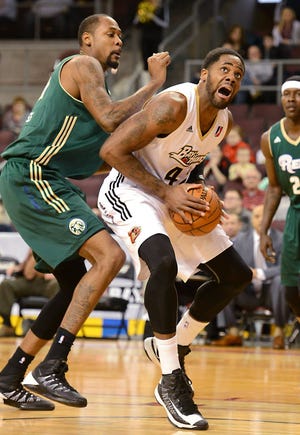 FILE PHOTO: In this Dec. 30, 2013, photo, Alex Oriakhi of the Erie Bayhawks tries to score on Mickell Gladness, left, of the Reno Bighorns during an NBA D-League game at Erie Insurance Arena in Erie, Pennsylvania.