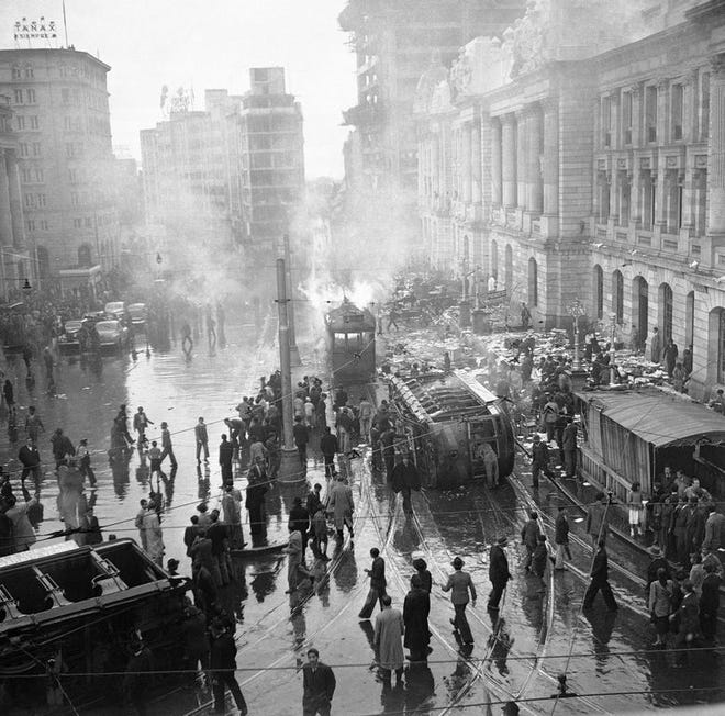 This April 1948, file photo shows rioting and looting as a street car is overturned and burned during an uprising following the assassination of Jorge Eliecer Gaitan in Bogota, Columbia. The 1948 assassination of populist firebrand Jorge Eliecer Gaitan sparked the political bloodletting known as "La Violencia," or "The Violence."