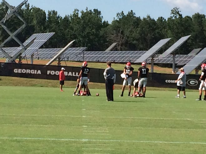Georgia quarterbacks Brice Ramsey (12), Jacob Eason (10) and Greyson Lambert (11) at practice on Aug. 25, 2016. (Marc Weiszer/Staff).
