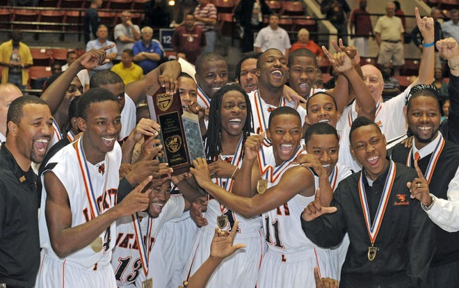 Marcel Thomas, far right, celebrates with his team after Leesburg won the Class 4A state title in 2011 at The Lakeland Center in Lakeland. Thomas is the new boys basketball coach at Lake Minneola. (Gatehouse Media file)