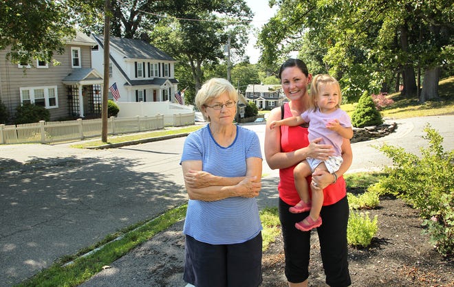 Ruth Spring and her daughter in law Laurie Bryan and her daughter Nora, 18 mos. enjoy their neighborhood adjacent to Maypole Hill. Quincy's Merrymount neighborhood is filled with tree lined streets and families,Thursday, July 21, 2016.
Gary Higgins/The Patriot Ledger