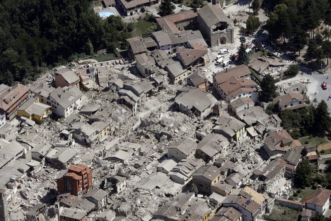 Aerial photo shows the damaged buildings in the historical part of the town of Amatrice, central Italy. AP Photo/Gregorio Borgia
