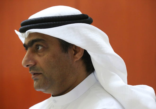Human rights activist Ahmed Mansoor speaks to Associated Press journalists in Ajman, United Arab Emirates, on Thursday, Aug. 25, 2016. Mansoor was recently targeted by spyware that can hack into Apple's iPhone handset. The company said Thursday it has updated its security. (AP Photo/Jon Gambrell)
