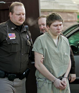 In this March 3, 2006, photo, Brendan Dassey, 16, is escorted out of a Manitowoc County Circuit courtroom in Manitowoc, Wis.The attorney for a Wisconsin inmate featured in the hit Netflix documentary series "Making a Murderer" filed a motion Friday seeking permission to perform extensive scientific tests on evidence she believes will show he's innocent.