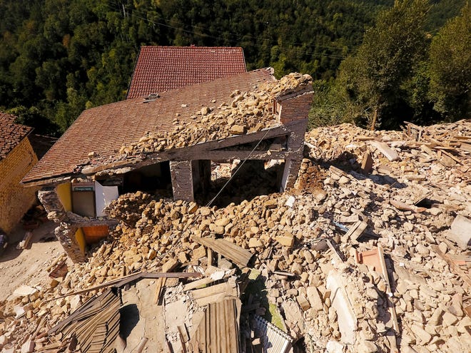 Aerial view of the village of Saletta in central Italy Friday, where a strong quake hit early Wednesday. Strong aftershocks rattled residents and rescue crews alike Friday as hopes began to dim that firefighters would find any more survivors as donations began pouring into the area and Italy again anguished over its failure to protect ancient towns and modern cities from the country's highly seismic terrain.