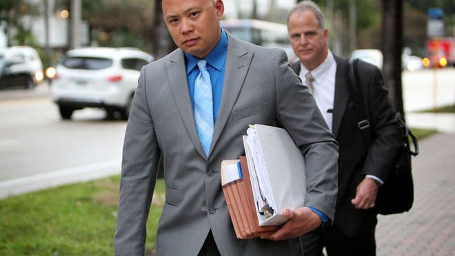 Sgt. Adams Lin leaves the U.S. Federal Courthouse in downtown Ft. Lauderdale on January 28, 2016. Dontrell Stephens, who became a paraplegic after being shot by Lin in September 2013, claims Palm Beach County sheriff’s deputy Lin used excessive force. (Richard Graulich / The Palm Beach Post)