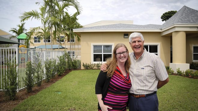 Preschool director Ashley Lugo and senior pastor Mark Miller stand in front of Church in the Gardens’ new education building Thursday, August 25, 2016. (Bruce R. Bennett / The Palm Beach Post)