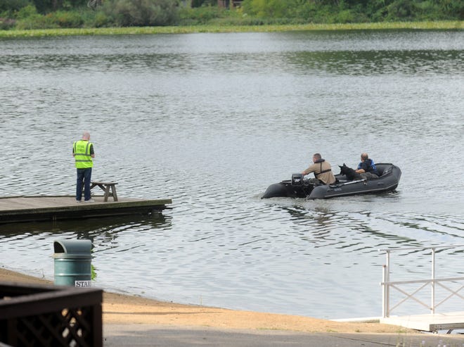 Perry Township and Massillon police along with other investigators search the area of Sippo Lake Park Friday for Phillip Kirkbride Jr. who was last seen Tuesday. CantonRep.com / JULIE VENNITTI