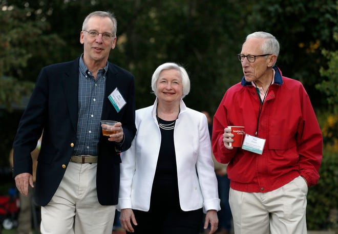 Federal Reserve Chairwoman Janet Yellen, center, strolls today with Stanley Fischer, right, vice chairman of the Board of Governors of the Federal Reserve System, and Bill Dudley, the president of the Federal Reserve Bank of New York, before her speech to the annual invitation-only conference of central bankers from around the world, at Jackson Lake Lodge in Grand Teton National Park, north of Jackson Hole, Wyo.