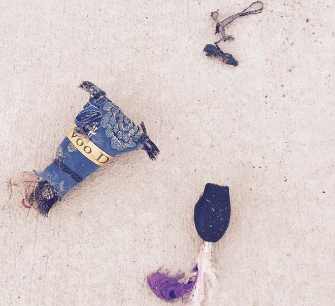 Tybee Island police say a voodoo doll and dead lizard were left outside their department early Friday morning. (Photo courtesy Tybee Island Police Department)