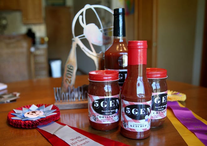 5Gen products — salsa, Bloody Mary mix and ketchup — are shown along with some of the awards the products have won at Kim Ham-Lanes’ home in Harrisburg. The salsa recipe has been passed down through the family for five generations, inspiring the name 5Gen.