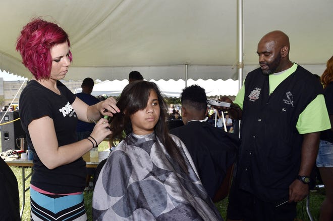 Erie kids say goodbye to summer, and hair, at back-to-school event