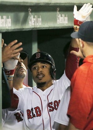 Boston's Mookie Betts celebrates his solo home run during the fifth inning of the Sox 8-3 win over Kansas City on Saturday night. AP photo