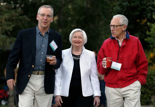 Federal Reserve Chair Janet Yellen strolls Friday with Stanley Fischer, right, vice chairman of the Board of Governors of the Federal Reserve System, and Bill Dudley, the president of the Federal Reserve Bank of New York, before her speech to the annual invitation-only conference of central bankers from around the world, at Jackson Lake Lodge in Grand Teton National Park, north of Jackson Hole, Wyoming.