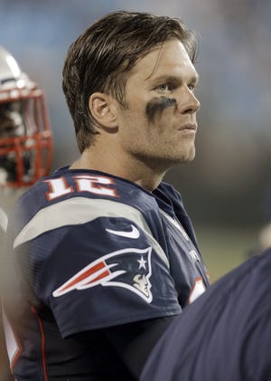 Patriots quarterback Tom Brady watches the action during the second half of Friday night's preseason game against the Carolina Panthers in Charlotte, N.C.