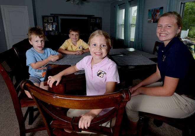 Jayden, Austin, Abiageal and Kailey Costello pose for a portrait at their home on Friday, Aug. 26, 2016 in Eustis, Fla. Three of the four Costello children attend the First Academy of Leesburg as a result of scholarships. The Florida Supreme Court may weigh in on whether Florida tax credit programs, which award the scholarships, are constitutional.