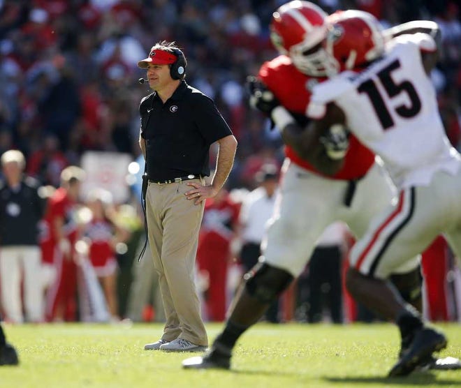 John Bazemore Associated Press Georgia first-year coach Kirby Smart watches during the second half of the Bulldogs' spring scrimmage on April 16 in Athens.
