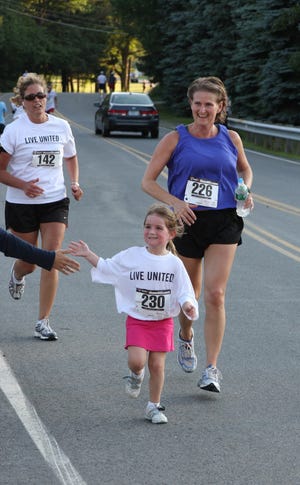 Volunteering at a fundraising race is a great way to contribute to a cause. Courtesy photo