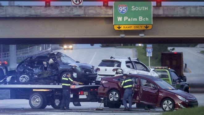 A multi-vehicle accident closed westbound Donald Ross Road near its intersection with I95 early Thursday morning, October 1, 2015. (Bruce R. Bennett / The Palm Beach Post)