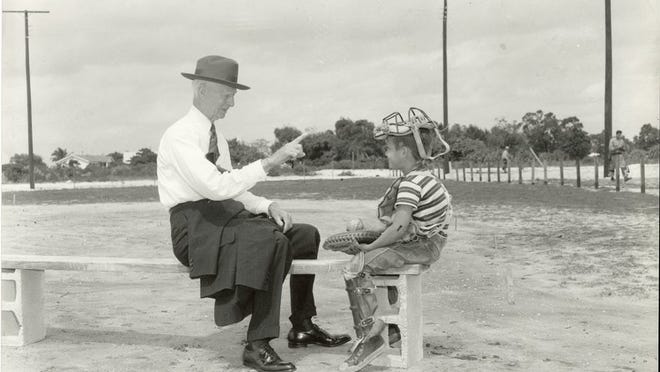 This photo of Connie Mack giving lesson to young Robert Corbitt at Phipps Park in 1952 is one the Historical Society plans to use in an exhibit exploring baseball in everyday life in the county. Contributed by Historical Society of Palm Beach County