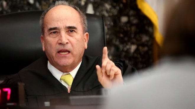 Circuit Judge Jack Schramm Cox sustains an objection to a recorded phone conversation during testimony by jail inmate and trial witness Frederick Cobia in a hearing before the murder trial of Jamal Smith at the Palm Beach County Courthouse on Dec. 30, 2015. (Richard Graulich / The Palm Beach Post)