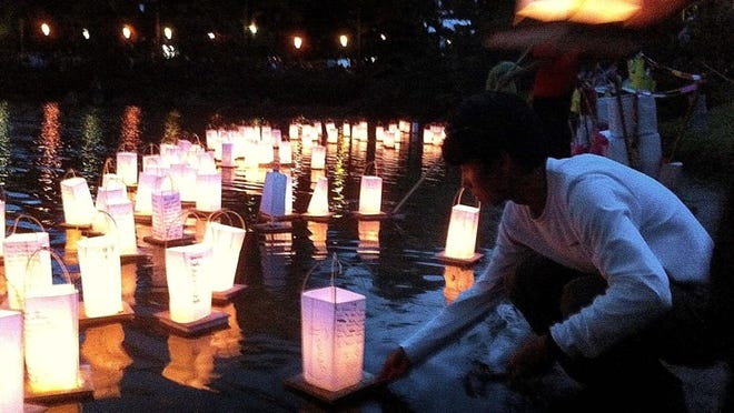 The ceremonial floating of prayer lanterns on Morikami Pond is one of the best parts of the annual Lantern Festival. Tickets for this year’s event sold out in record time. (Thomas Cordy/The Palm Beach Post)