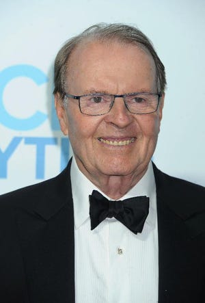 Charles Osgood arrives at the 2014 Daytime Emmy Awards Afterparty at The Beverly Hilton in Beverly Hills, Calif. Osgood, who has said "good morning" to his audience every Sunday, will say "goodbye" as host of "CBS News Sunday Morning." (Photo by Katy Winn/Invision/AP, File)