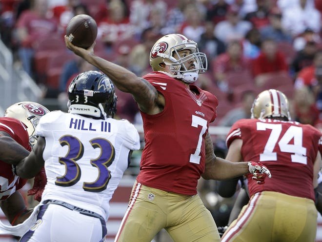 In this Oct. 18, 2015, file photo, San Francisco 49ers quarterback Colin Kaepernick (7) throws a pass in front of Baltimore Ravens strong safety Will Hill (33) during the first half of an NFL football game in Santa Clara, Calif. San Francisco general manager Trent Baalke said Wednesday, Feb. 24, 2016, he expects Kaepernick to be with the 49ers next season.