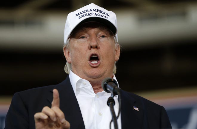 Republican presidential candidate Donald Trump, shown speaking in Des Moines, Iowa, on Saturday, promised on Twitter that he'll make a major speech on illegal immigration on Wednesday. (AP Photo/Gerald Herbert)