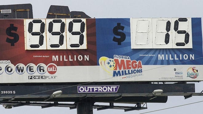The Powerball side of the Florida Lottery’s billboard in Lake Worth can only reach $999 million — not quite the record $1.3 billion jackpot that’ll be top prize Wednesday. (Bill Ingram / The Palm Beach Post)
