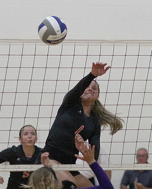 Paige Andrews of Sturgis blasts a kill attempt on South Haven Monday in the Lady Trojans’ win.