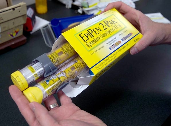After criticism over the skyrocketing price of its products, EpiPen maker Mylan says it will launch a cheaper, generic alternative to the brand-name allergy injections. Rich Pedroncelli / AP file photo