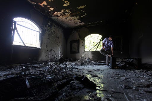 In this Sept. 13, 2012, file photo, a Libyan man investigates the inside of the U.S. consulate in Benghazi, Libya, after a deadly attack two days earlier. (AP Photo/Mohammad Hannon, File)