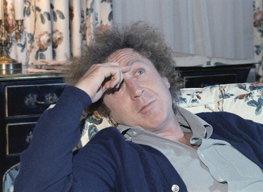 In a Dec. 9, 1977, file photo, actor Gene Wilder is shown during an interview with Jean Claude Bouis at his New York City Hotel. (AP Photo/Richard Drew, File)