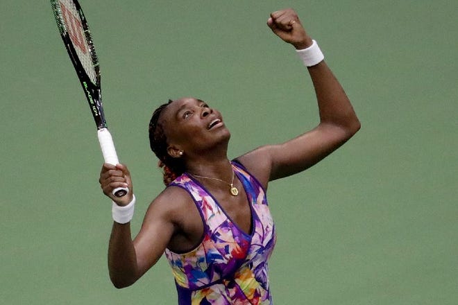 Venus Williams reacts after defeating Kateryna Kozlova, of the Ukraine, during the first round of the U.S. Open tennis tournament, Tuesday, Aug. 30, 2016, in New York. (AP Photo/Julio Cortez)