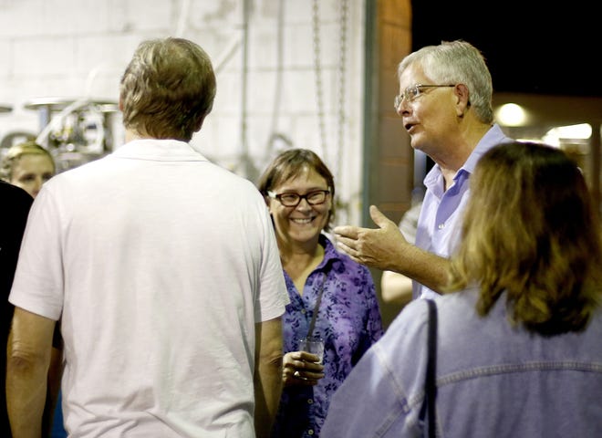 County Commissioner Robert "Hutch" Hutchinson talks with supporters while watching election results at First Magnitude Brewery onTuesday. (Matt Stamey/Staff photographer)