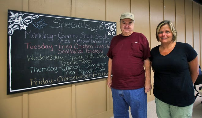 Brittany Randolph/The StarRonnie Anthony and Sonja Saylor show off the Alli´s Place specials board on Tuesday. The new restaurant is located at 891 North Post Road in Shelby.