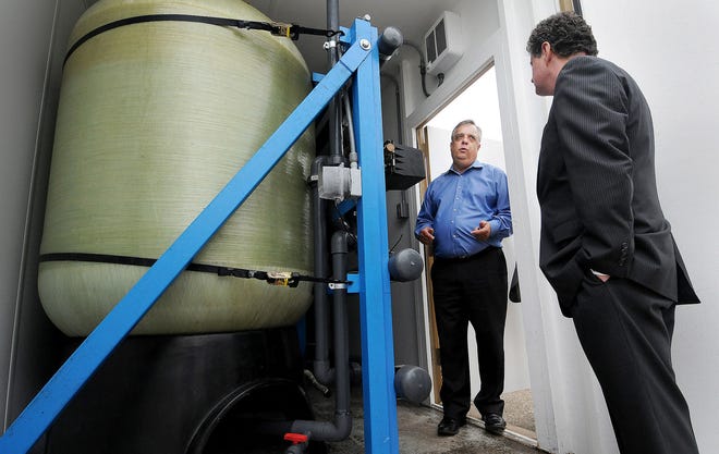 Tim Hagey, left, director of the Warminster Municipal Authority, gives former Bucks County Congressman Michael Fitzpatrick a tour of Well 26 in Warminster on Thursday, Sept 1, 2016. Fitzpatrick also toured Well 10 and looked at the different filtration systems put in place to clean out contaminants in drinking water that were found in area wells.