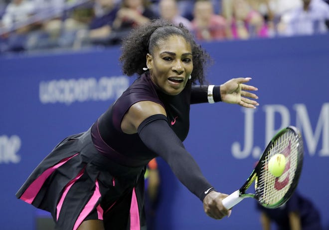 Serena Williams returns a shot to Vania King during Thursday's second round of the U.S. Open in New York.

Darron Cummings/Associated Press