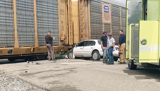 A car hit a train Wednesday while crossing the track on Palmer Highway in Ridgeway Township.